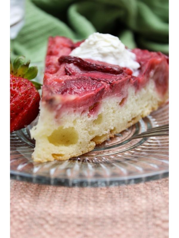 strawberry upside down cake slice on a plate